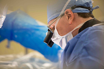 Surgeon performs minimally invasive spine surgery 
